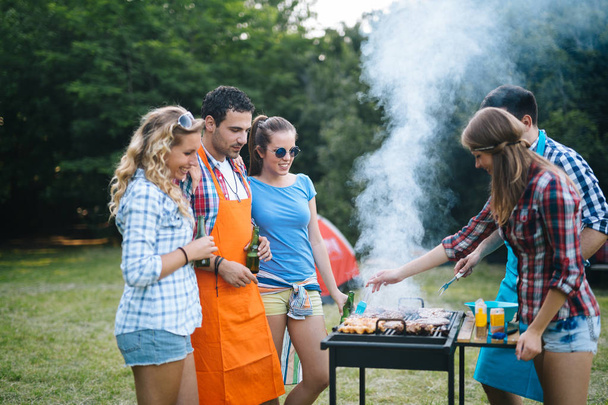 Young people having  bbq party in nature - Fotoğraf, Görsel