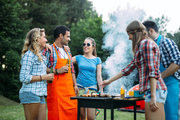 Young people having  bbq party in nature - Photo, image