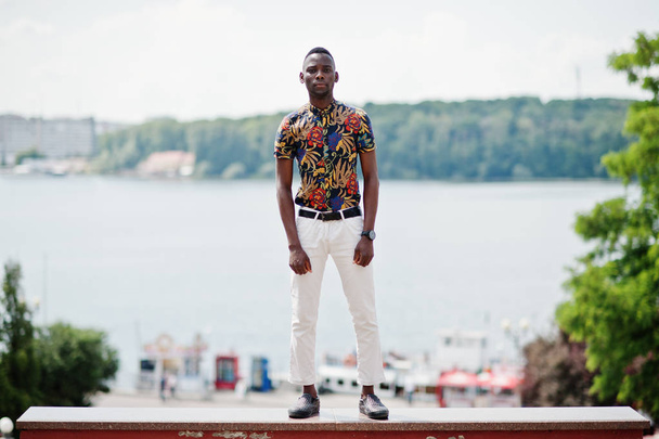 African man posed at street of city wear on shirt and white pants. - Valokuva, kuva