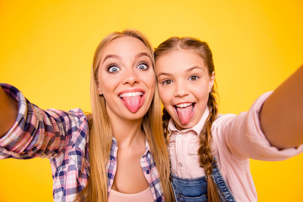 Taking instagram selfie! Close up photo portrait of comic funky rejoicing joking delightful cheerful beautiful with teeth cute carefree girls making photography isolated on bright vivid background - Фото, изображение