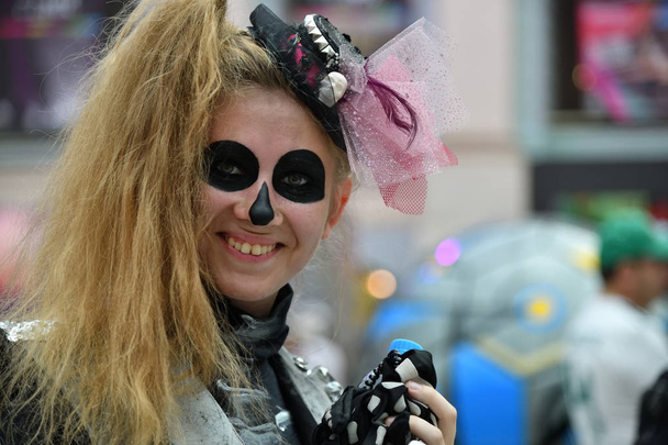 Moscow, Russia - June 29, 2018: Woman with skull makeup during during Dia de los Muertos Mexican carnival. Day of The Dead - Fotografie, Obrázek