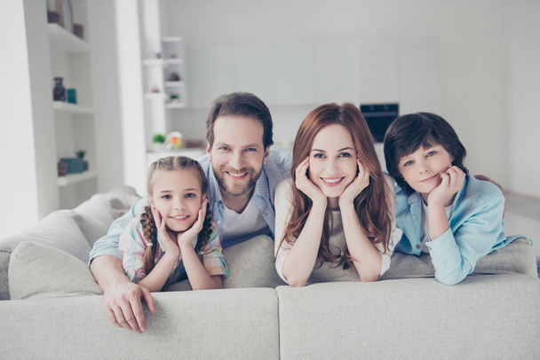 Portrait of trendy best family with two kids, husband wife schoolgirl and schoolboy spending time together indoor in modern white apartments. Domestic comfort cosiness concept - Φωτογραφία, εικόνα