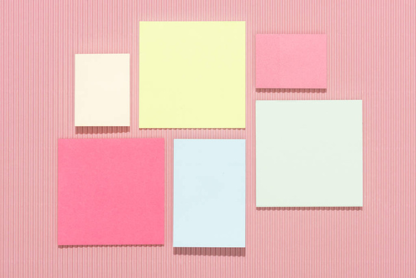 top view of empty colorful stick it notes on pink  - Photo, Image