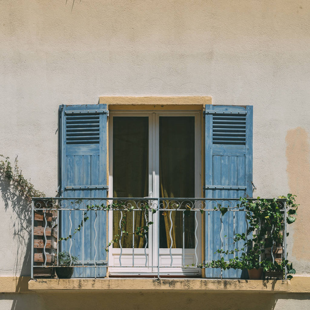 Bright blue shutters balcony in Provence, France - Fotó, kép