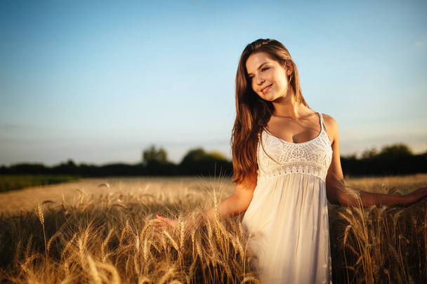 Young beautiful happy woman spending time in nature - Fotó, kép
