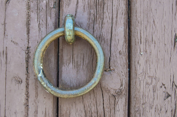 iron ring on a wooden boards background - Photo, Image