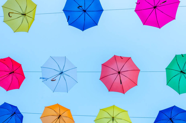 Colorful umbrellas background in the sky. Street decoration. - Foto, Imagen