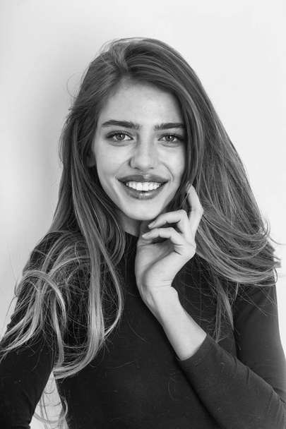 portrait of a girl. sexy pretty smiling girl with long blond hair in black - Foto, Imagem