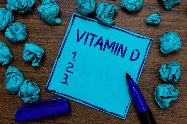 Handwriting text Vitamin D. Concept meaning Benefits of sunbeam exposure and certain fat soluble nutriments Cyan paper imagination idea thoughts mistakes several tries marker pen - Photo, Image