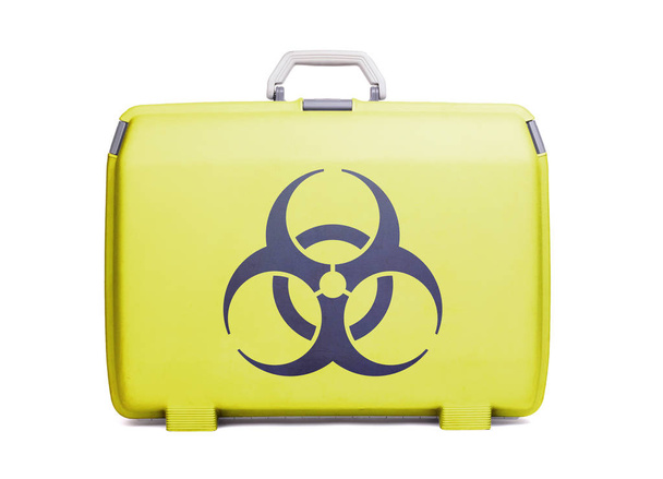 Used plastic suitcase with stains and scratches, printed with sign, danger, biohazard - Photo, Image