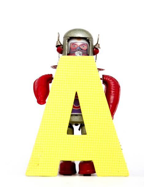 capital letter A held by vintage robot toys  - Photo, Image
