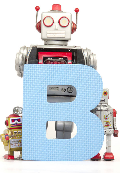 capital letter B held by vintage robot toys  - Photo, Image