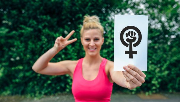 Woman showing symbol of feminism - Photo, Image