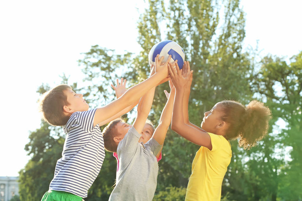 Cute children playing with ball outdoors - Fotografie, Obrázek