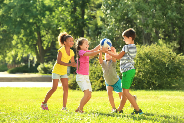Cute children playing with ball in park - Φωτογραφία, εικόνα