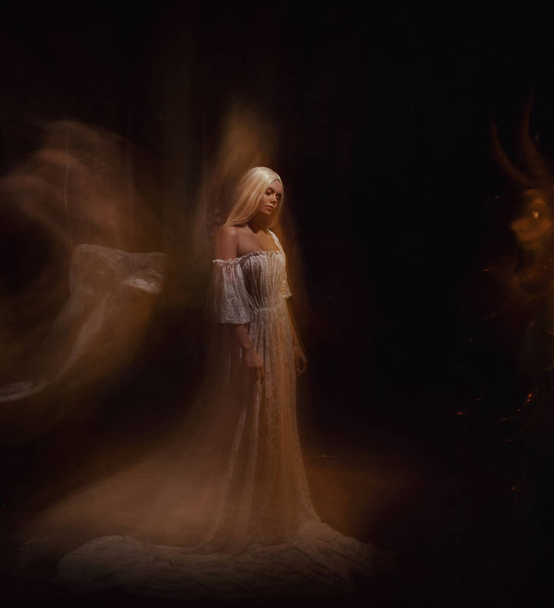 A beauty and a monster of darkness. Ariadne and the Minotaur. The girl is blonde, like a ghost, in a white vintage dress, a gothic, artistic photo bearing emotions of despair and sadness - Fotoğraf, Görsel
