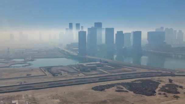 Skylines under the thick fog at the street timelapse of Abu Dhabi at morning - Metraje, vídeo