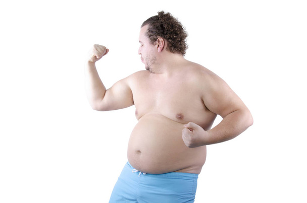 Funny bodybuilder. Fat man.  - Foto, afbeelding