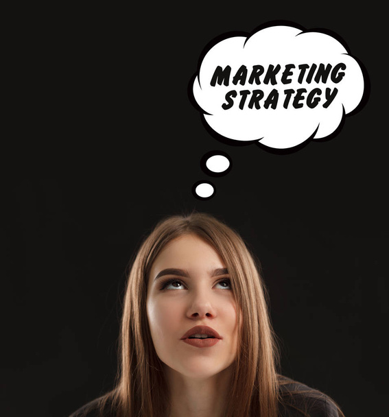 The concept of marketing, technology, the Internet and the network. The young entrepreneur gets an idea: marketing strategy - Fotografie, Obrázek
