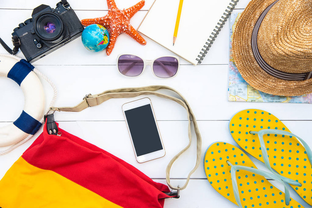 Accessories costume with travel for summer on wooden floor - Φωτογραφία, εικόνα