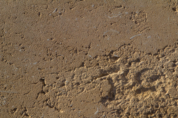textura pozadí žluté betonová zeď pod sluncem - Fotografie, Obrázek