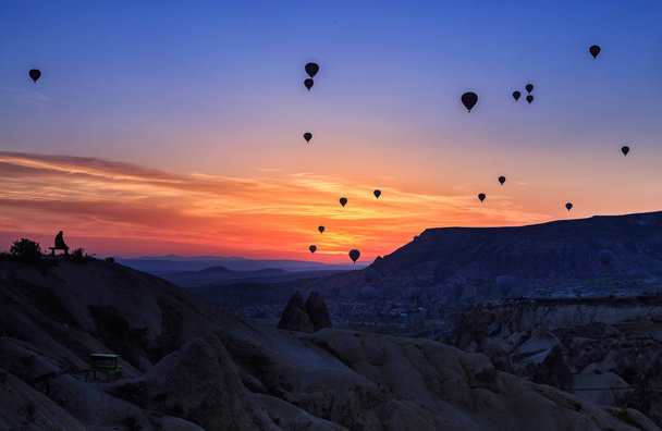 beautiful sunrise with balloons in the Cappadocia Valley - Photo, Image