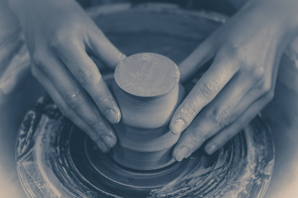 Photo in old vintage style. Creating ceramic products of white clay close-up. - Photo, Image