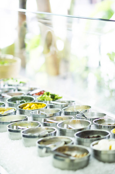 bowls of mixed fresh organic vegetables in modern salad bar display - Photo, Image