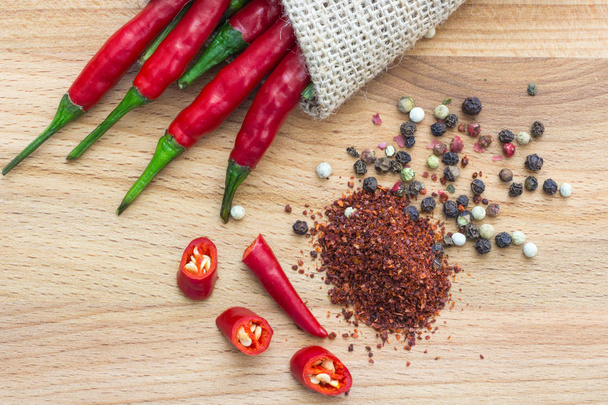 sharp Chile pepper on a wood background - Fotografie, Obrázek