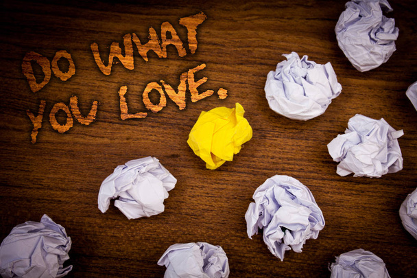 Conceptual hand writing showing Do What You Love.. Business photo showcasing Positive Desire Happiness Interest Pleasure Happy Choice Words wooden desk crumbled white yellow paper - Photo, Image