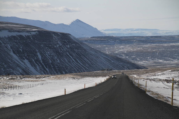 Road in Iceland. Landscape and road in winter, road trip on the country at Iceland. Beautifull nature of Iceland. Epic and majestic landsacapes. Route Number One (Ring Road). - Zdjęcie, obraz