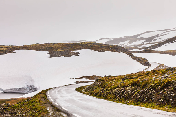 Snowfield and mountain road Aurlandsvegen between Aurland and Laerdal in Norway, summer time - Фото, зображення