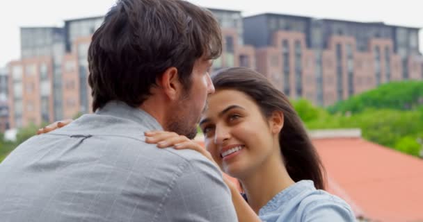 Romantic couple interacting with each other in balcony 4k - Filmmaterial, Video