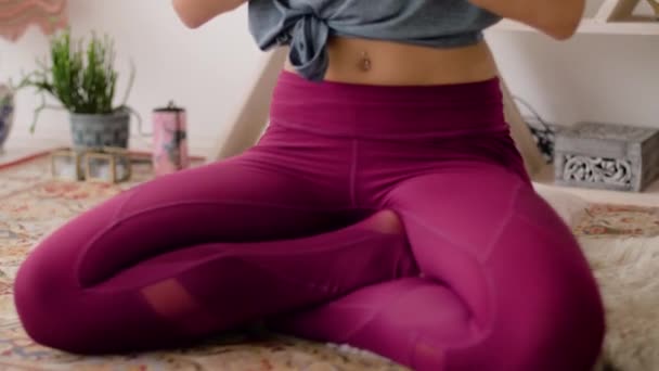 woman meditating in lotus pose at yoga studio - Video, Çekim