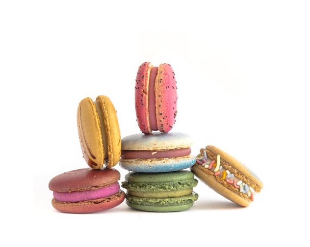 Variety of macaroons isolated on white background. Studio shot delicious and colorful French macaroon. Pastel colors of sweet food dessert, delicacy, colorful cookies - Photo, Image
