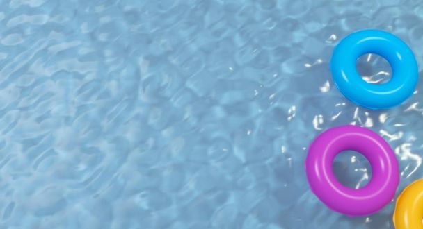 Letecký pohled na barevné nafukovací prstenec kobliha hračky v bazénové vody shora, vykreslování 3d objektů - Fotografie, Obrázek