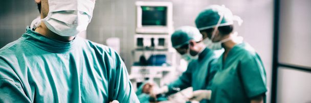 Portrait of surgeon with arms crossed in operation room - Photo, Image