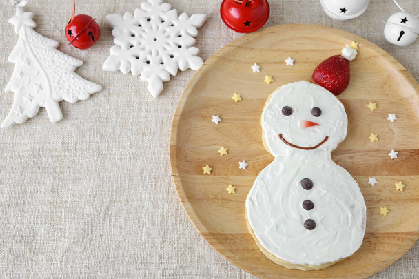 Fun homemade snowman pancake breakfast for kids, copy space background - Photo, Image