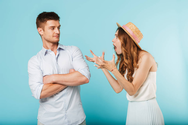 Image of young angry caucasian loving couple friends isolated over blue background quarrel. - Fotoğraf, Görsel