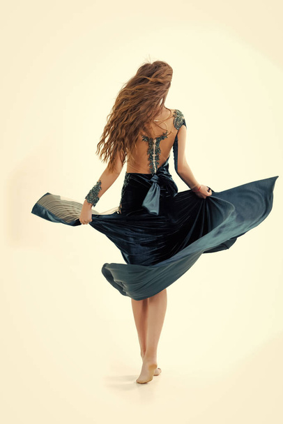 Evening dress. Woman with long brunette hair, back view - Fotoğraf, Görsel