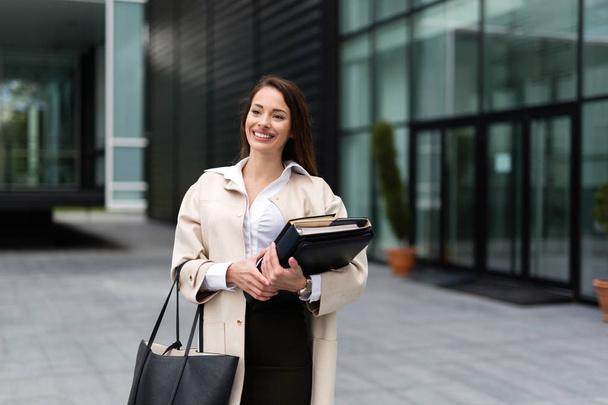 Portrait of young attractive businesswoman going to office - Foto, immagini