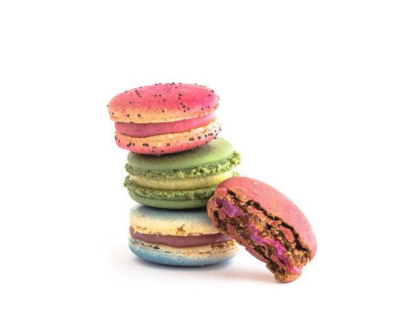 Different types of whole macaroons and pieces isolated on white background. Studio shot delicious and colorful French macaroon. Pastel colors of sweet food dessert, delicacy, colorful cookies - Photo, Image