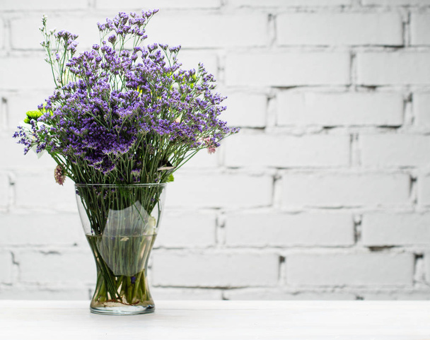 Glass vase with fresh flowers close-up copy space - Foto, Imagem