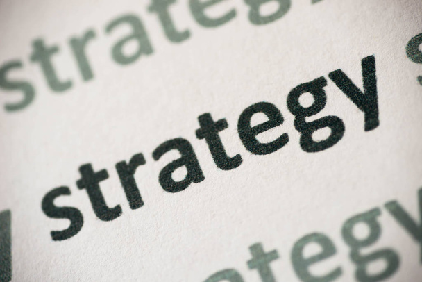 word strategy printed on white paper macro - Zdjęcie, obraz
