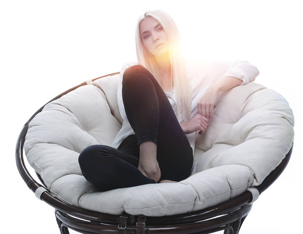 beautiful young woman sitting on the couch in a large comfortabl - Φωτογραφία, εικόνα