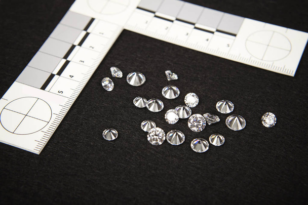 Seized contraband of smuggled diamonds documented by police authority with metric scale - Foto, Imagen