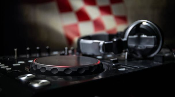 Soccer 2018 club party concept. Close up view of dj deck with selective focus. Useful as club poster, empty space. - Photo, Image