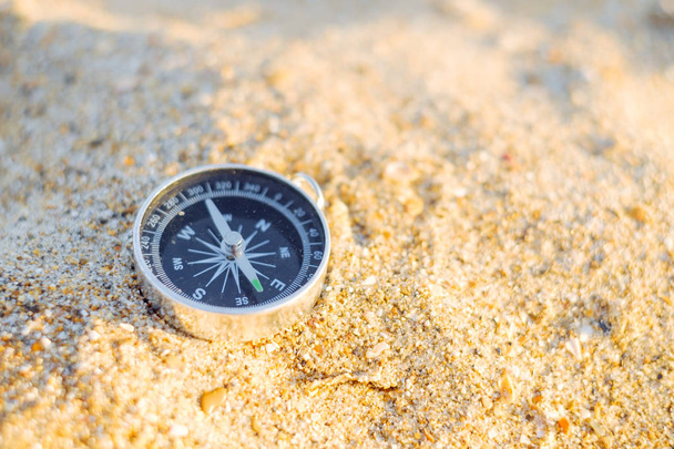 Travel magnetic compass on sand outdoor, nobody. - Fotoğraf, Görsel