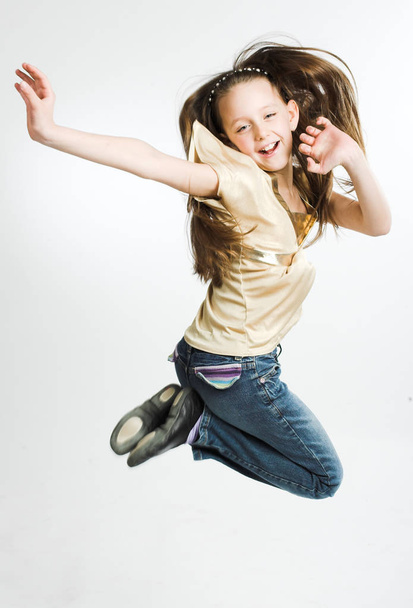 girl jumps on a white background - Фото, изображение