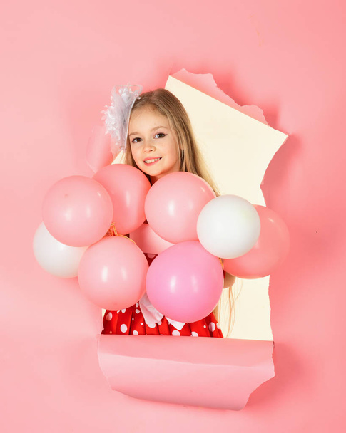 little girl in party dress looking at camera with her pink balloon. - Φωτογραφία, εικόνα